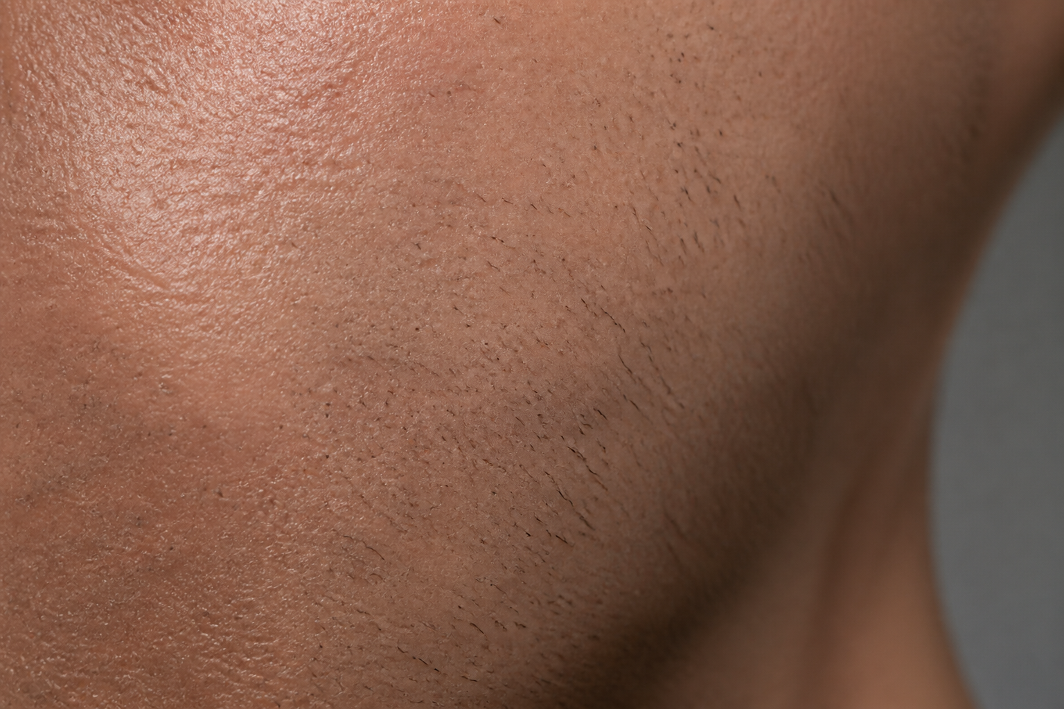 Male skin texture and subtle stubble detail